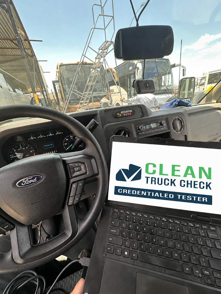 Clean Truck Check testing laptop connected inside a semi truck cab